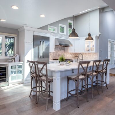 White painted kitchen cabinets with stainless steel appliances JM Kitchen & Bath Design