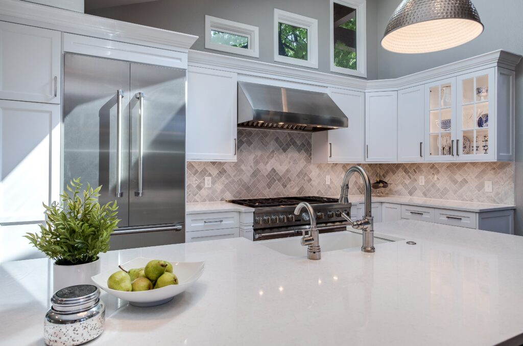 White shaker kitchen cabinets with white marble countertops