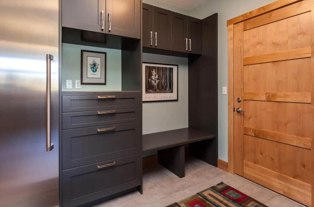 laundry room / mud room from JM Kitchen & Bath Design with storage space, cabinet space, and large refrigerator