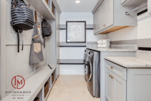 remodeled laundry room and mud room by JM Kitchen & Bath Design featuring modern appliances, modern cabinetry, and plenty of storage