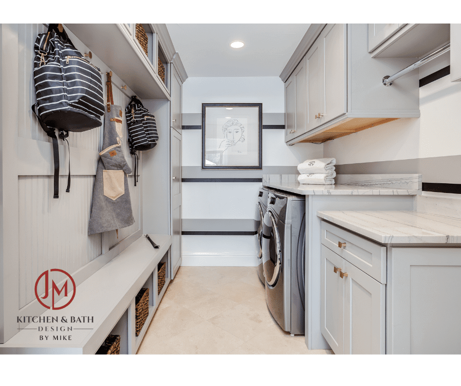 remodeled laundry room and mud room by JM Kitchen & Bath Design featuring modern appliances, modern cabinetry, and plenty of storage