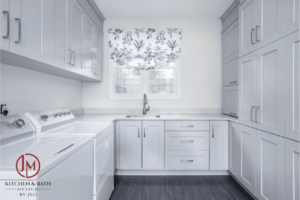 remodeled laundry room with white appliances, sink, and plenty of white cabinets JM Kitchen & Bath Design