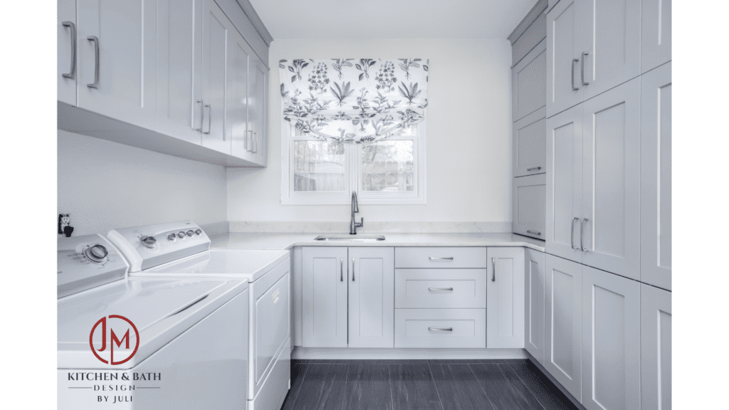 remodeled laundry room with white appliances, sink, and plenty of white cabinets JM Kitchen & Bath Design