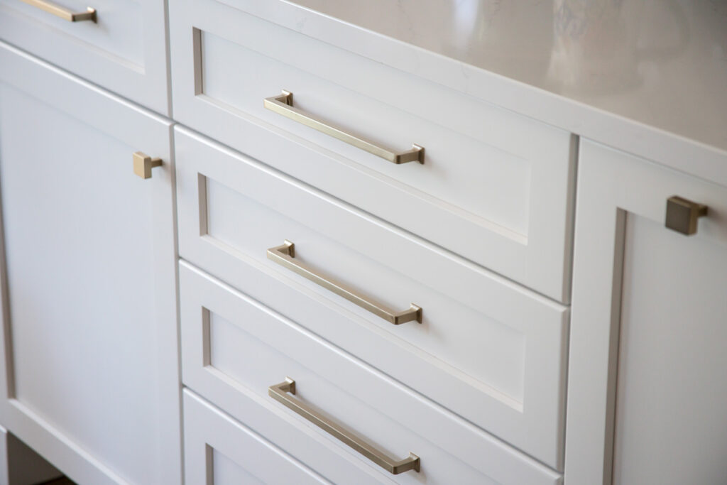 The cabinet hardware is Top Knobs Ascendra in Honey Bronze finish (Brushed Gold)