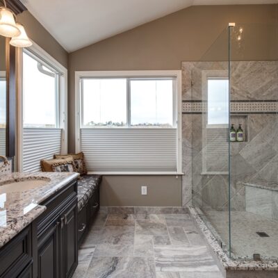 Master bath with granite vanity and glass shower JM Kitchen & Bath Design