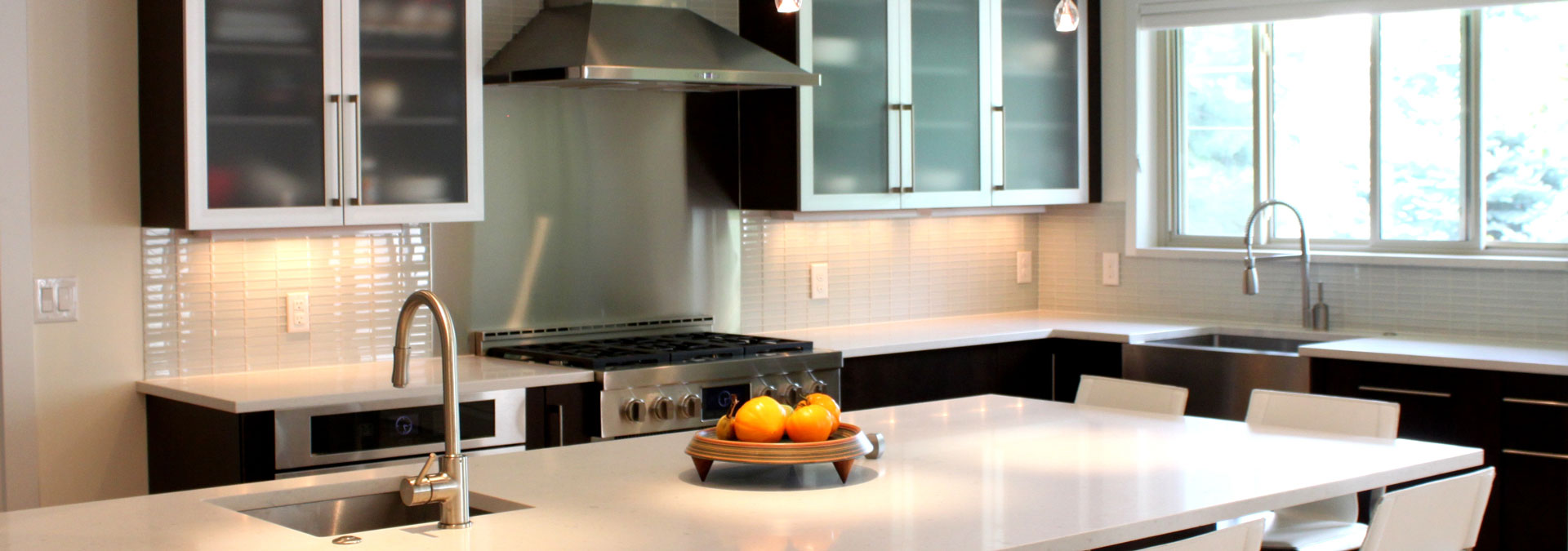 remodeled kitchen features clean, square lines with island JM Kitchen & Bath Design