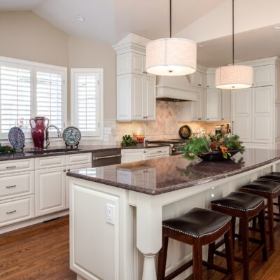 White painted cabinets with dark granite countertop JM Kitchen & Bath Design