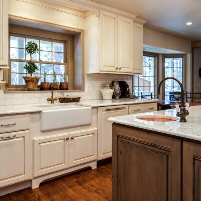 Off white cabinets with dark wood island JM Kitchen & Bath Design