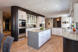 White glass cabinets with grey center island kitchen JM Kitchen & Bath Design