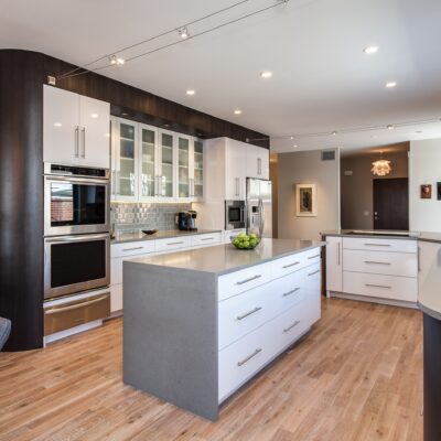 White glass cabinets with grey center island kitchen JM Kitchen & Bath Design