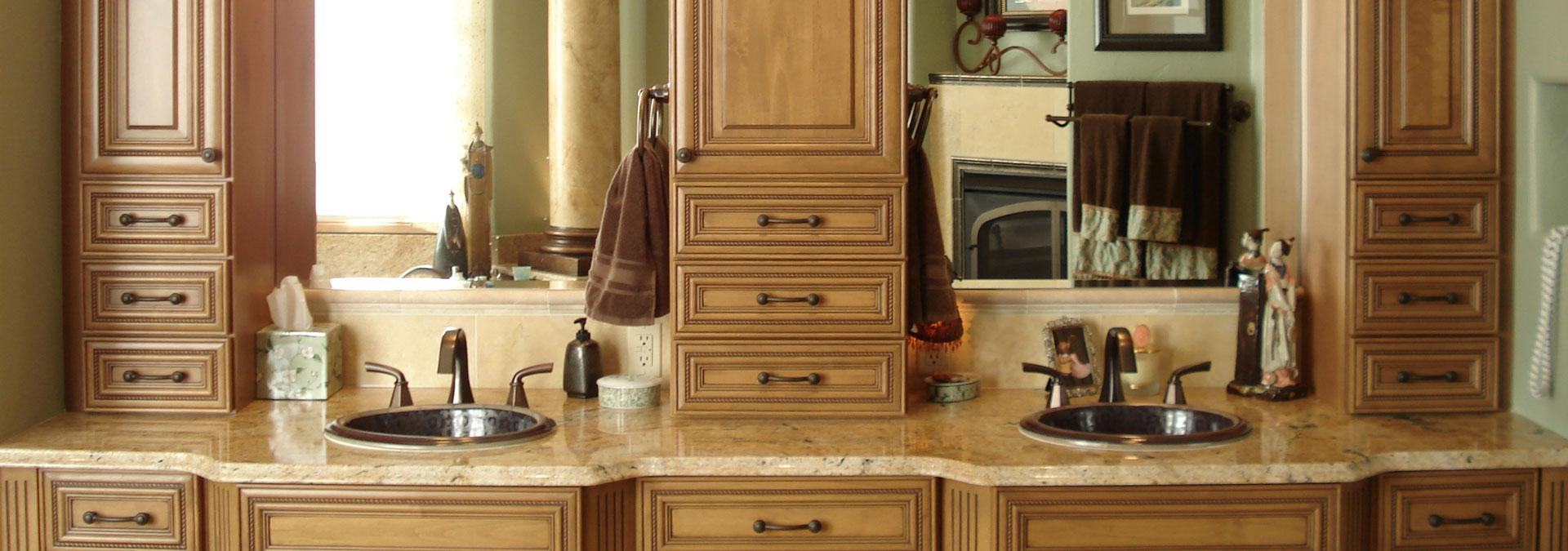 bathroom remodel features traditional finishes and cabinet storage between two sinks JM Kitchen & Bath Design