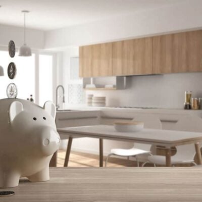 ultra modern kitchen designed on a budget with white piggy bank in the foreground JM Kitchen & Bath Design