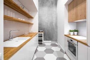 modern small kitchen featuring no hardware on cabinets to save space and open shelving JM Kitchen & Bath Design