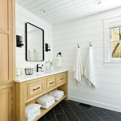 bathroom remodel featuring spa feel with white wall and ceiling and light wood cabinets JM Kitchen & Bath Design