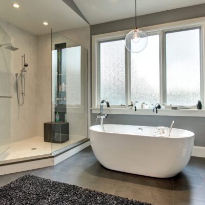 Modern bathroom with glass shower and tub JM Kitchen & Bath Design