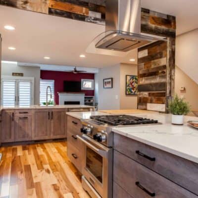 stainless steel Range hood in this Denver Contemporary Kitchen Remodel by Juli JM Kitchen & Bath Design