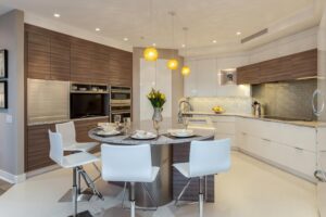 Modern kitchen with sleek grey cabinetry JM Kitchen & Bath Design