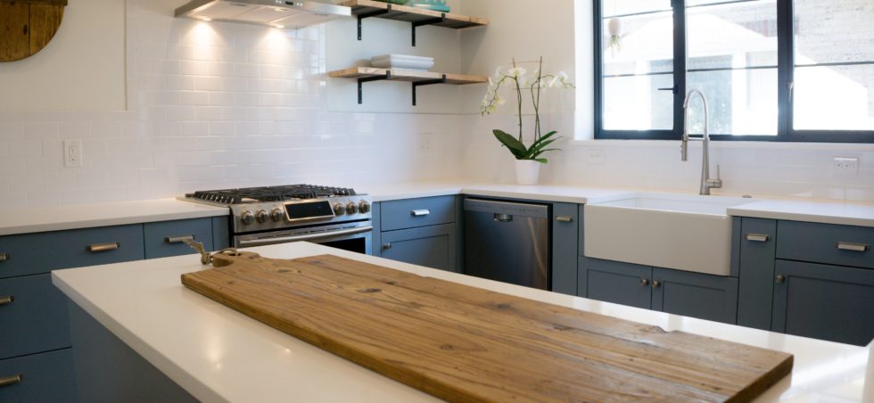 Blue painted cabinets with marble countertop