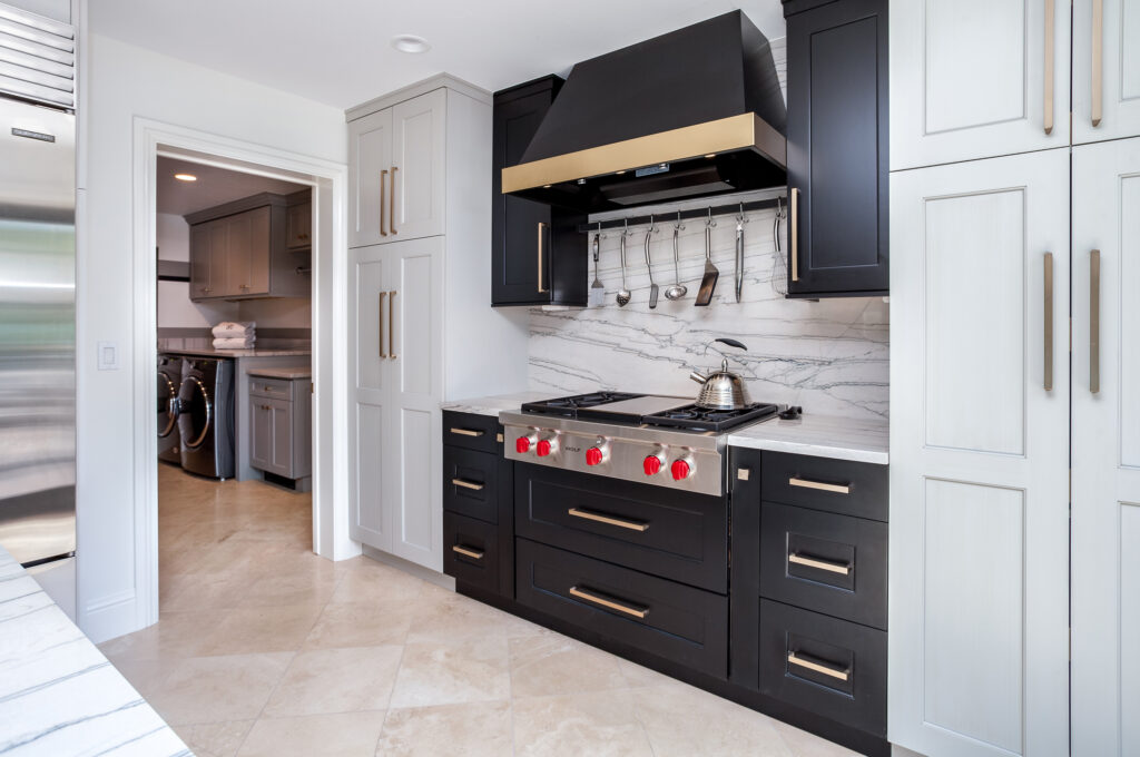 Black Stove top with two tone stove hood in Greenwood Village Kitchen Renovation 