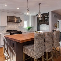 Small kitchen with wicker chairs JM Kitchen & Bath Design