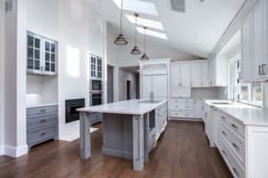 White painted kitchen cabinets with light grey painted island JM Kitchen & Bath Design