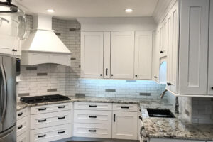 white kitchen remodel with italian subway tile JM Kitchen & Bath Design